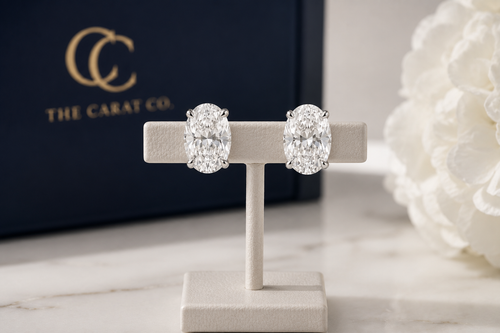 Oval diamond stud earrings in a tapered setting, from The Carat Co.